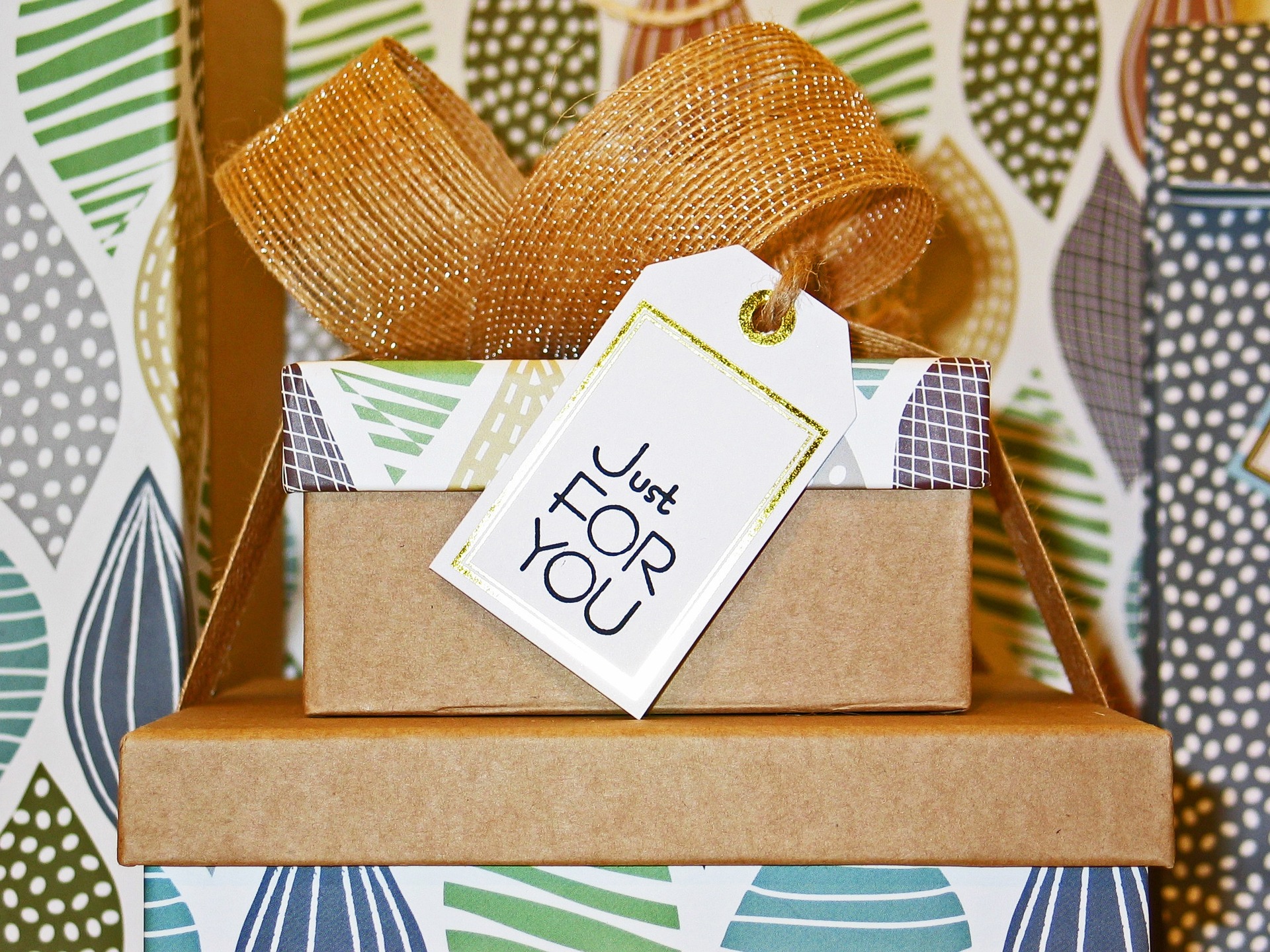 Two parcel boxes with a ribbon and a 'just for you' text tag
